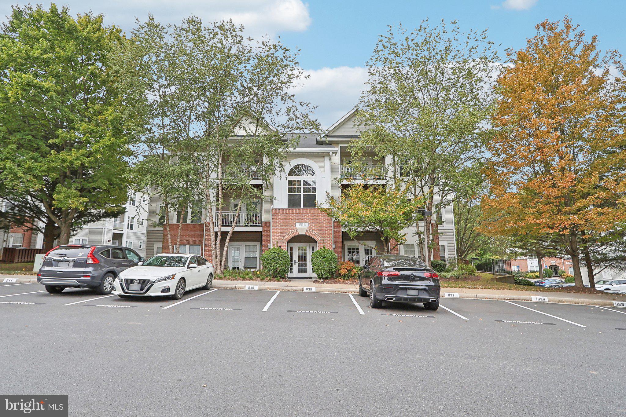 1516 North Point Drive, Unit 301 Reston, VA 20194 - Photo 2 of 31 a car parked in front of a building