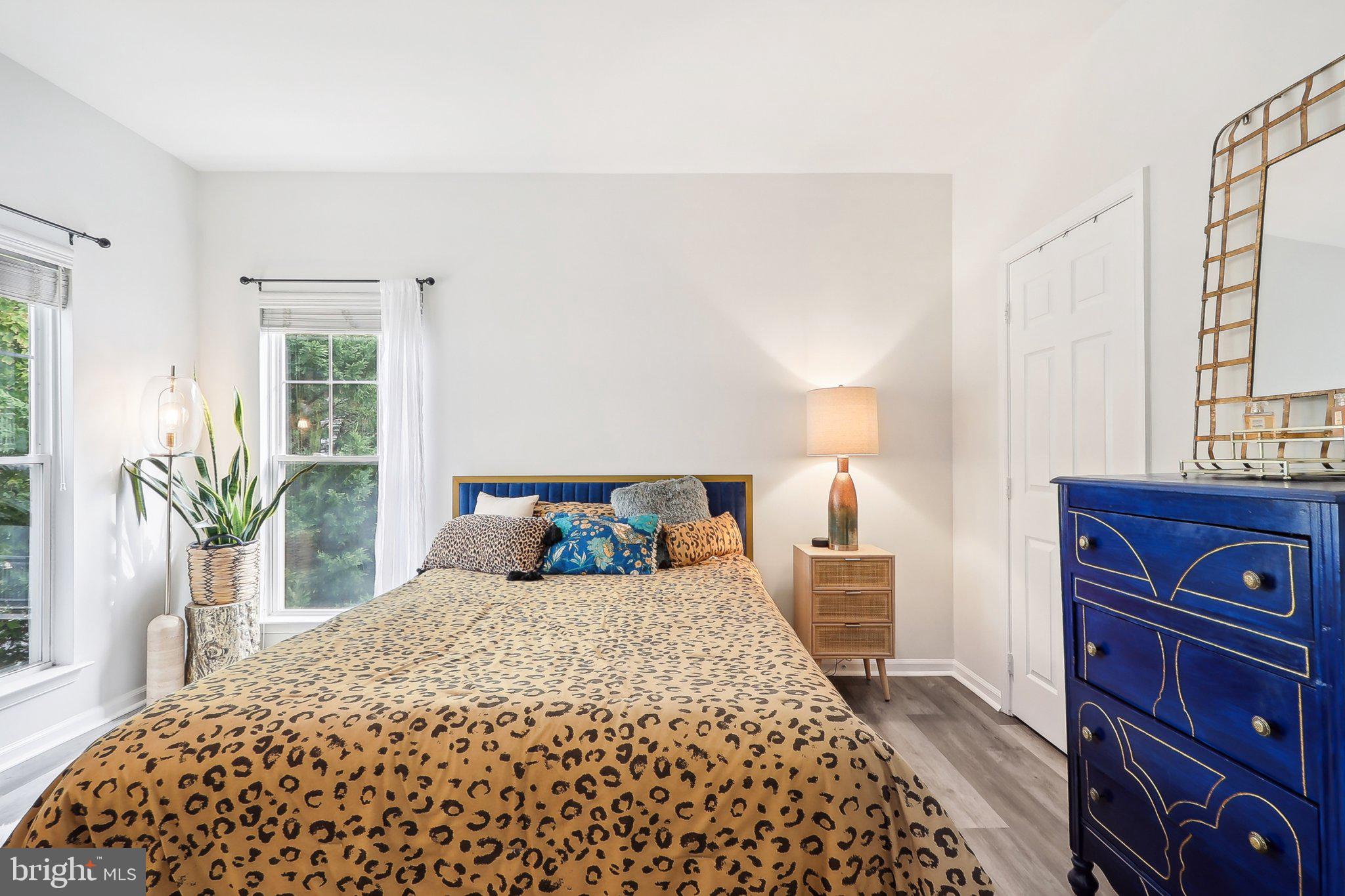 1516 North Point Drive, Unit 301 Reston, VA 20194 - Photo 21 of 31 a bedroom with a large bed and a window