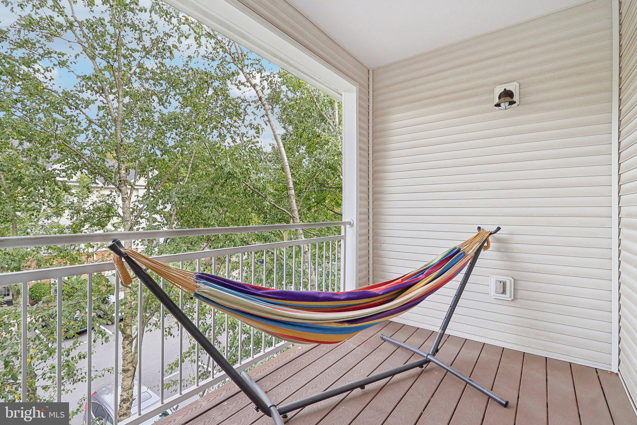 1516 North Point Drive, Unit 301 Reston, VA 20194 - Photo 29 of 31 a view of a wooden deck with a bench