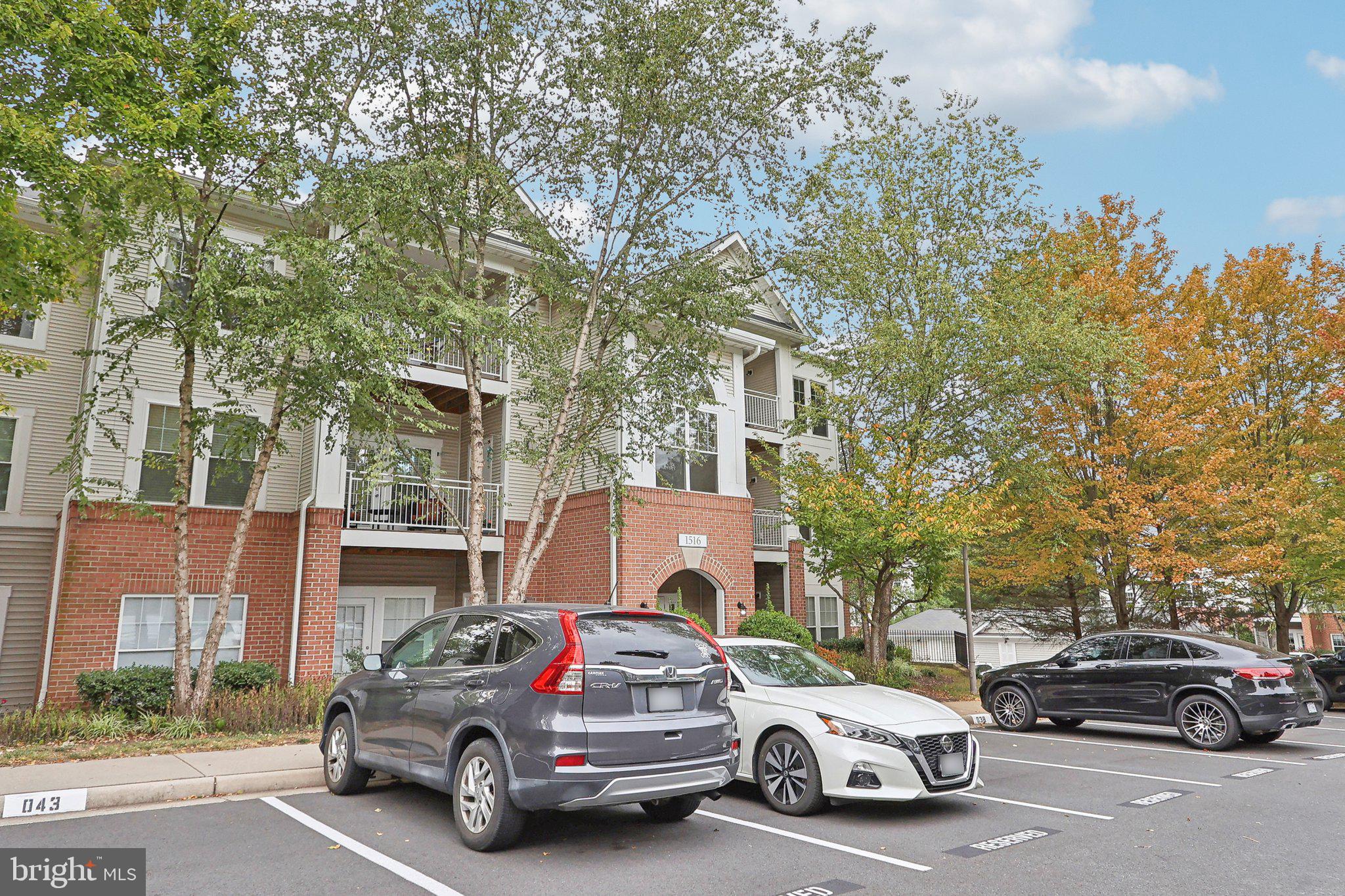 1516 North Point Drive, Unit 301 Reston, VA 20194 - Photo 3 of 31 a car parked in front of a house