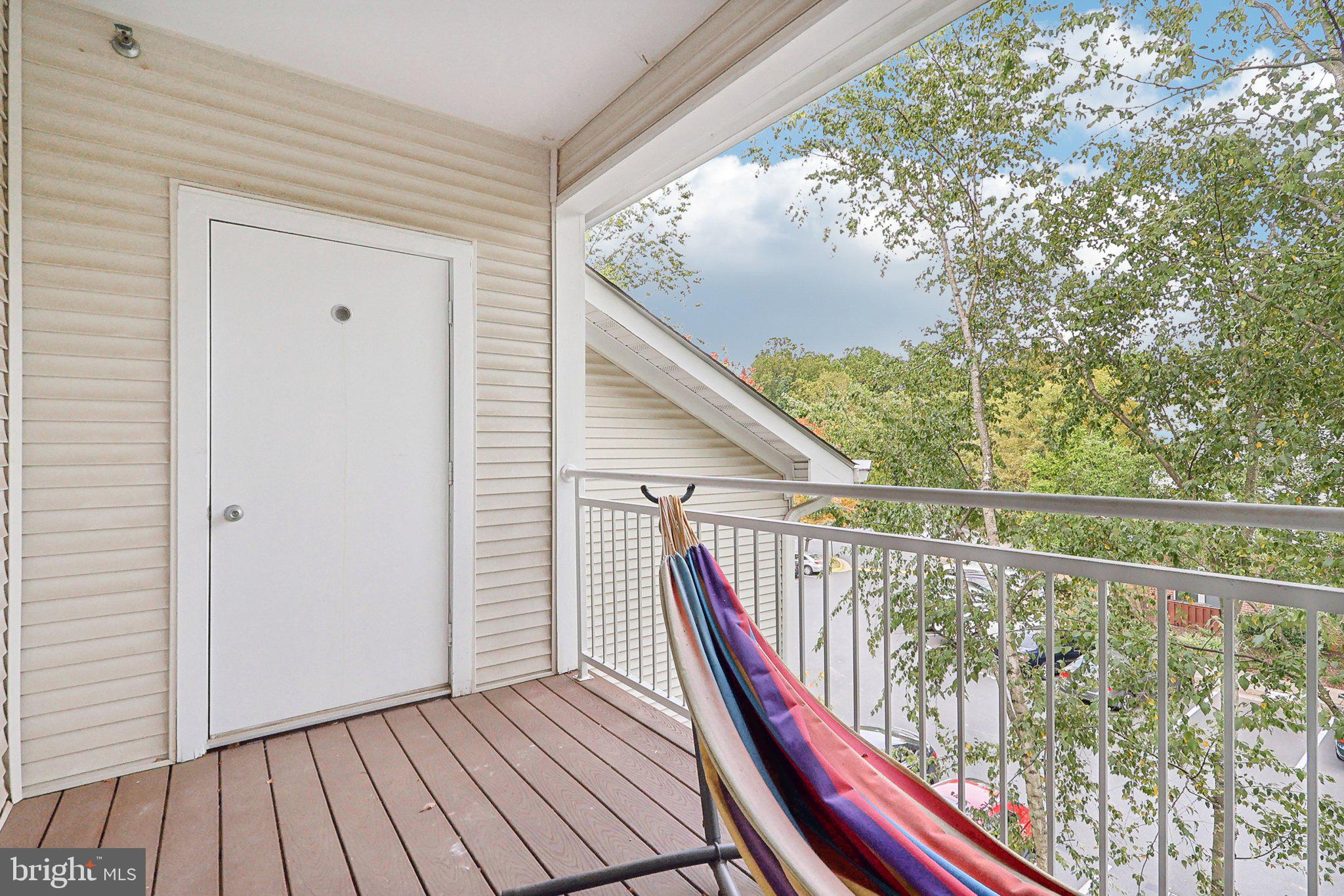 1516 North Point Drive, Unit 301 Reston, VA 20194 - Photo 31 of 31 a view of deck with wooden floor and fence