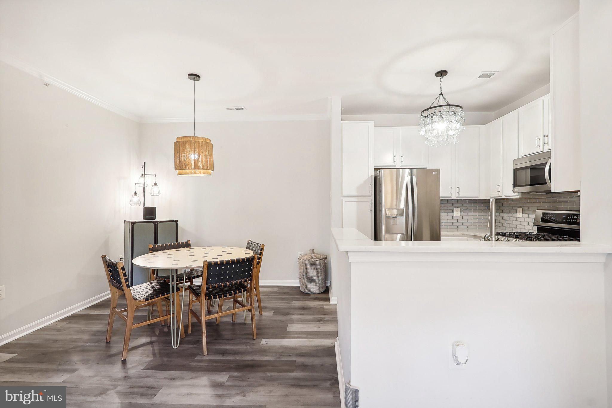 1516 North Point Drive, Unit 301 Reston, VA 20194 - Photo 8 of 31 a view of a dining room with furniture