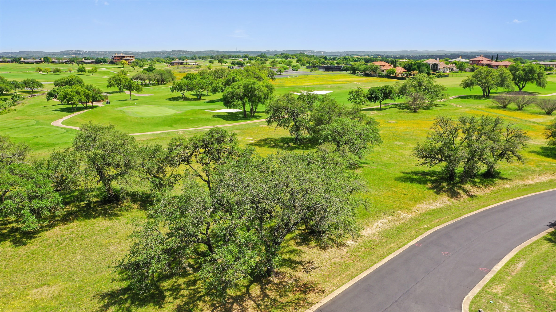 2711 Cliff Point Spicewood, TX 78669 - Photo 1 of 22 a view of a lake with a beach