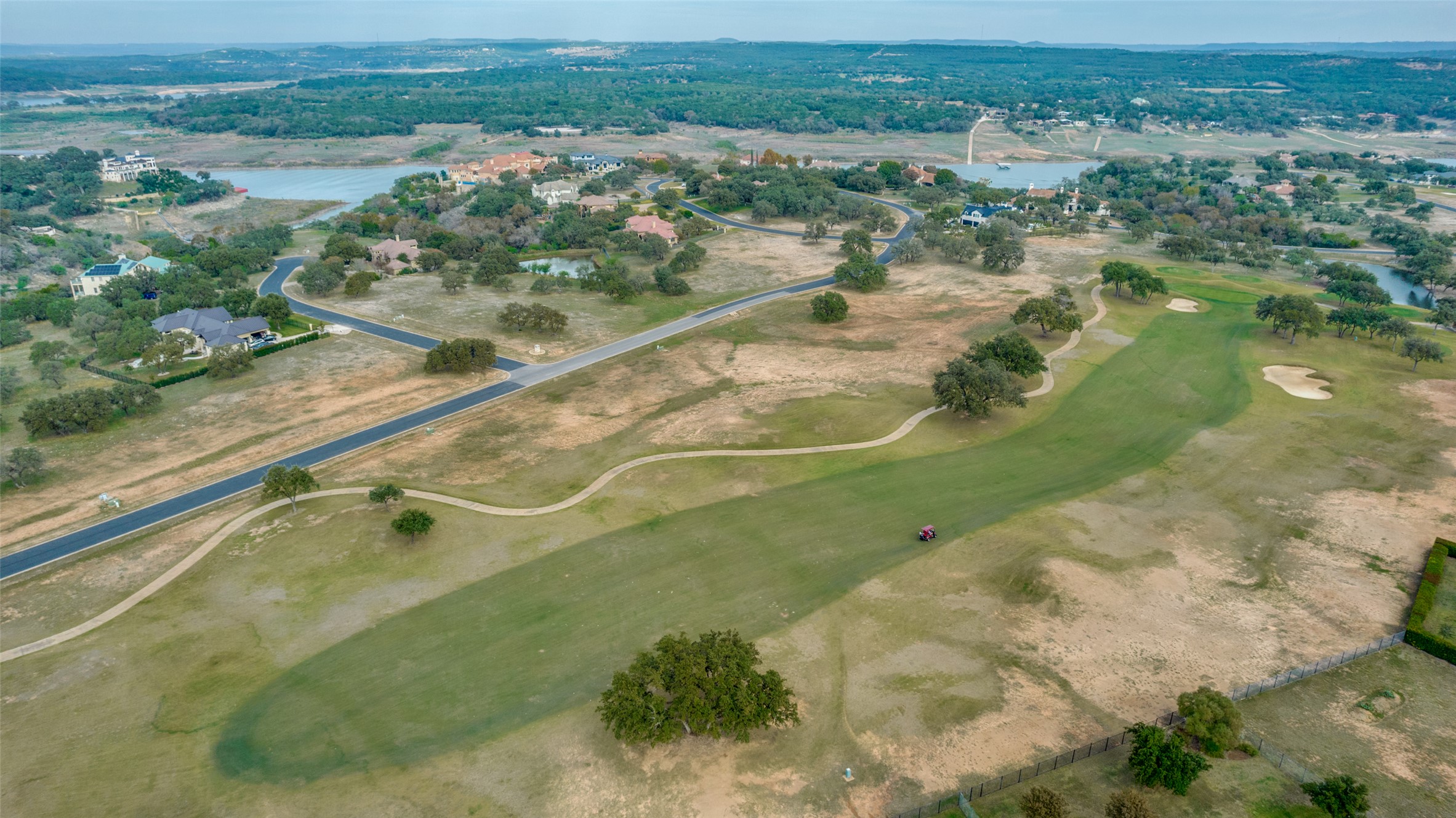 2711 Cliff Point Spicewood, TX 78669 - Photo 15 of 22 an aerial view of residential houses with outdoor space and river