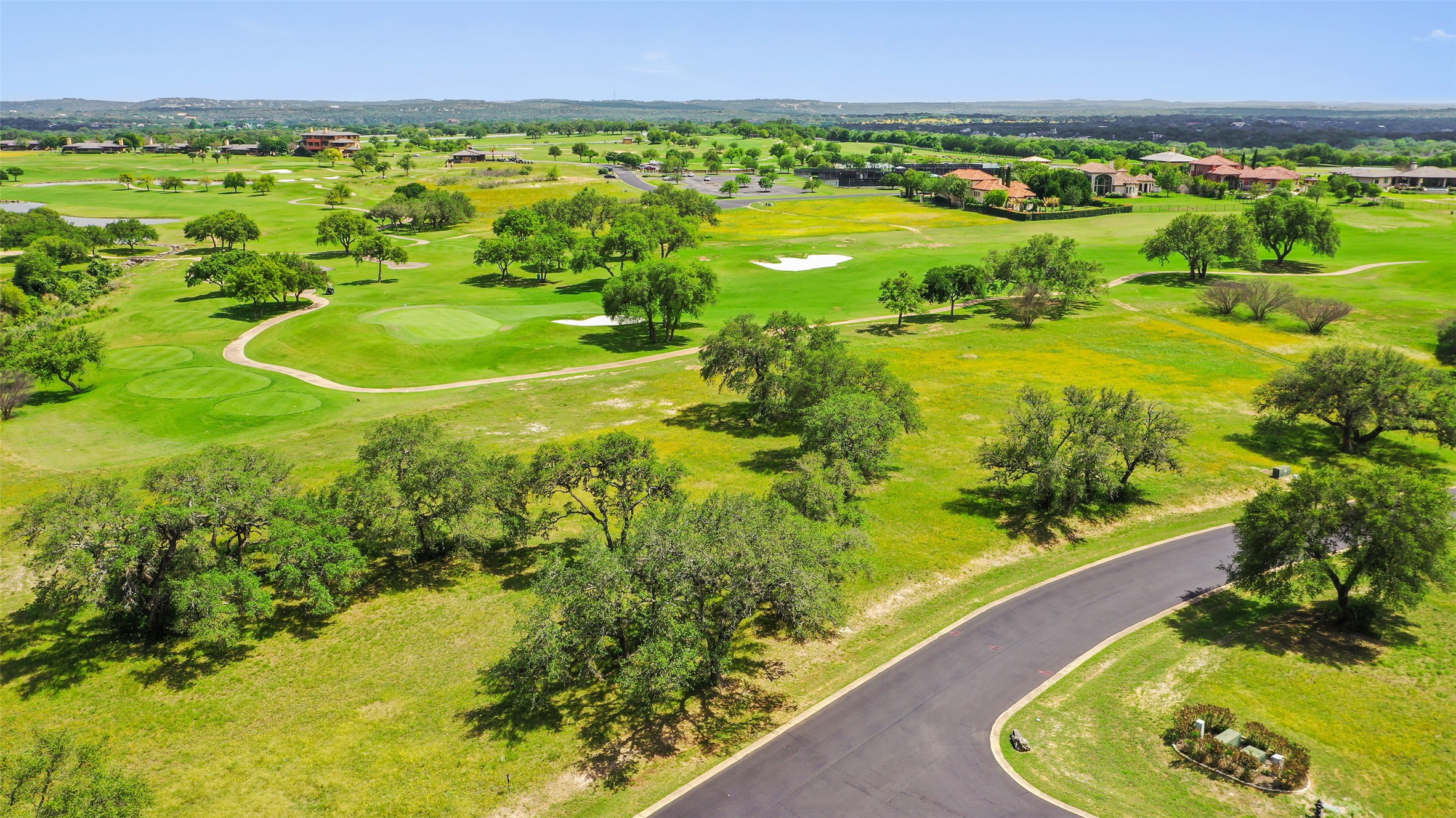 2711 Cliff Point Spicewood, TX 78669 - Photo 3 of 22 a view of a swimming pool with a garden