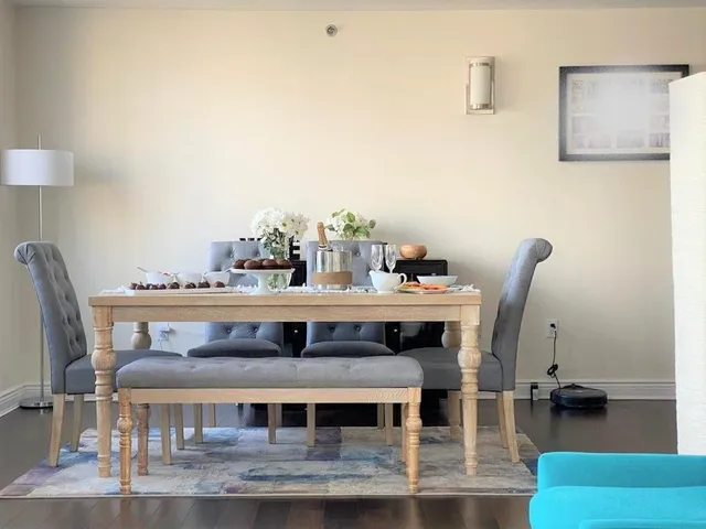 a view of a dining room with furniture window and wooden floor