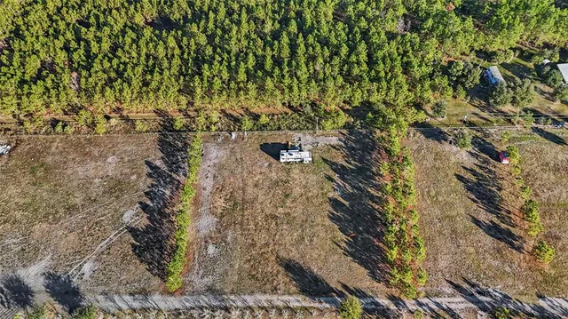 a view of a lake with a big yard