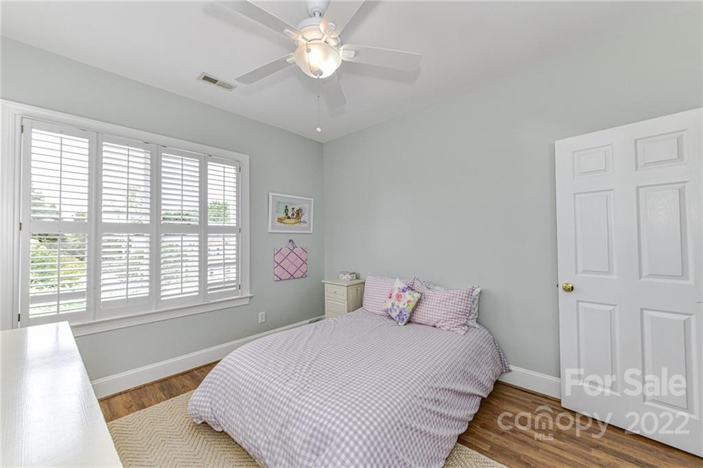 113 Morrison Hill Road Davidson, NC 28036 - Photo 17 of 27 a bedroom with a large bed and a window