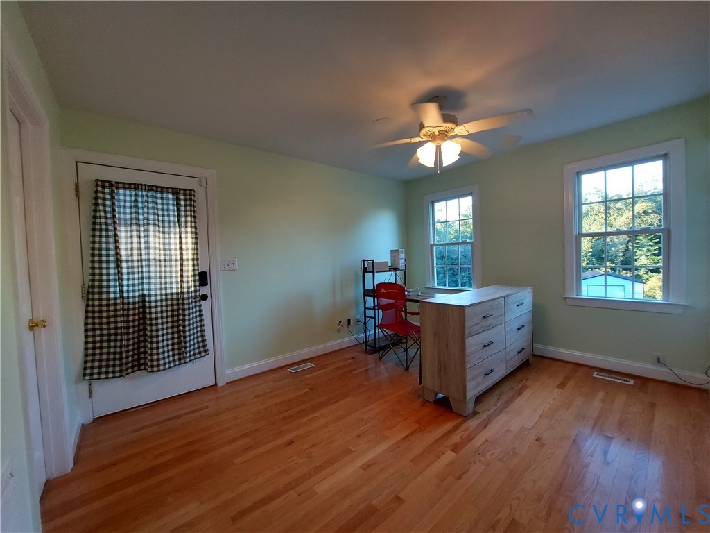 18313 Shiloh Church Road Beaverdam, VA 23015 - Photo 17 of 39 a living room with furniture and a chandelier