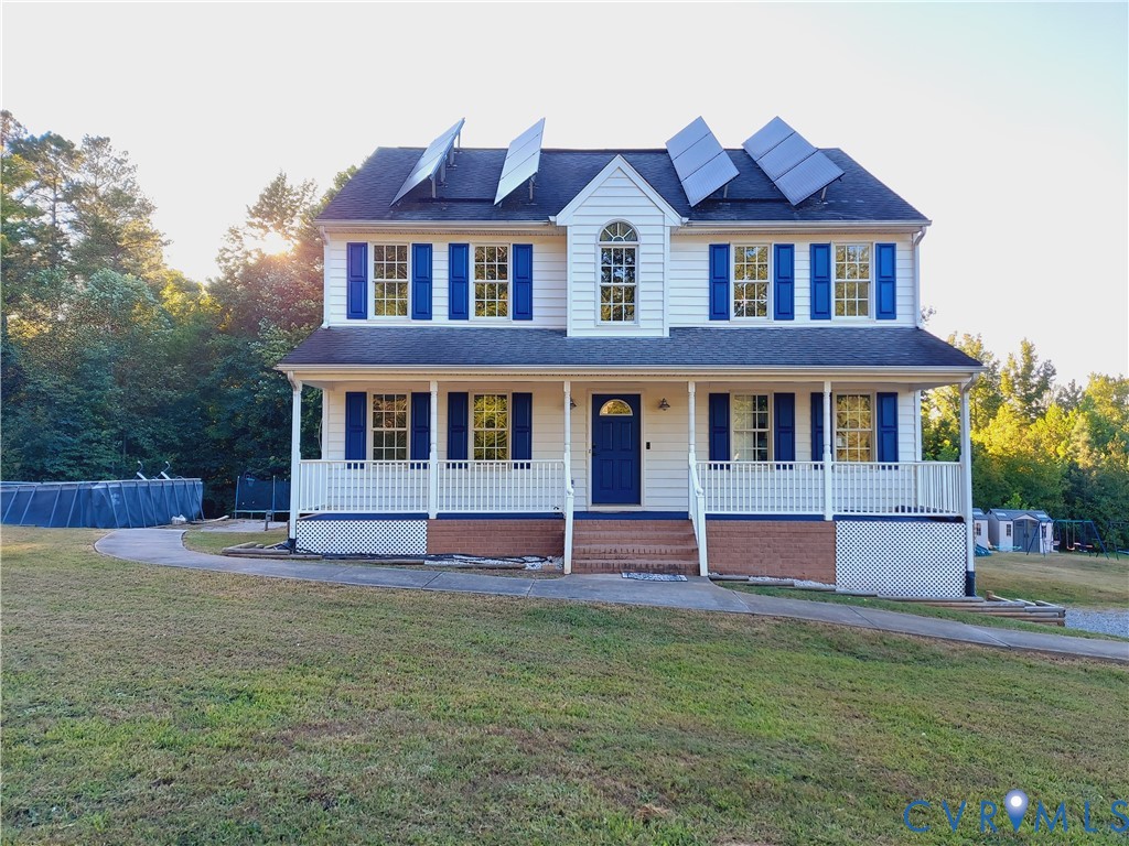 18313 Shiloh Church Road Beaverdam, VA 23015 - Photo 2 of 39 a house that has a lot of windows in it