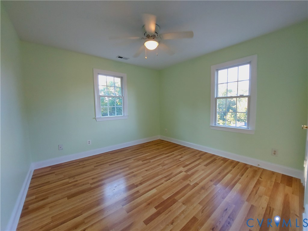 18313 Shiloh Church Road Beaverdam, VA 23015 - Photo 23 of 39 a view of empty room with wooden floor and fan