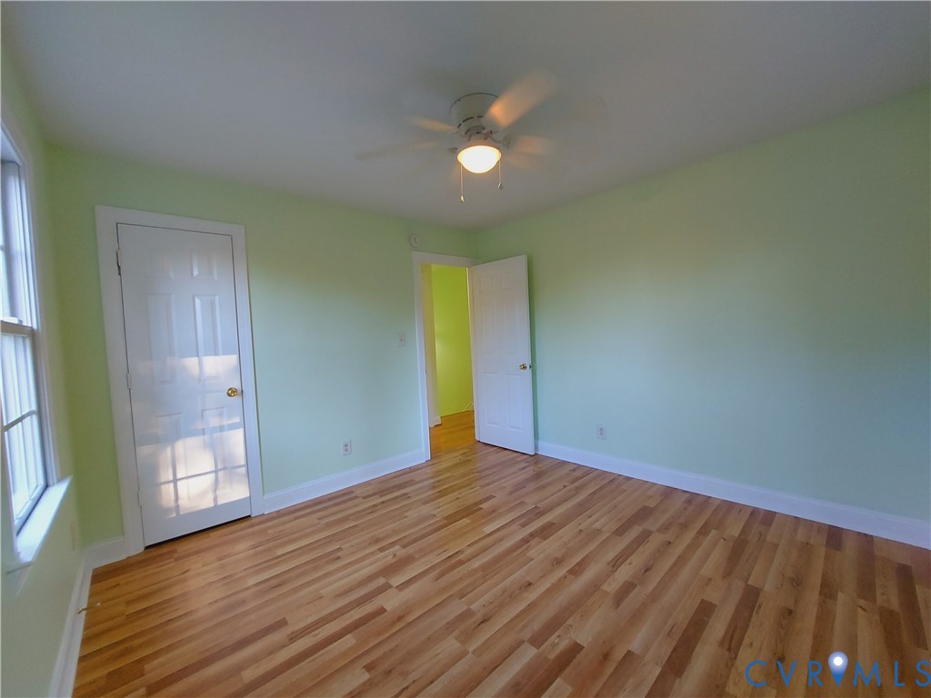 18313 Shiloh Church Road Beaverdam, VA 23015 - Photo 25 of 39 a view of an empty room with wooden floor and a window