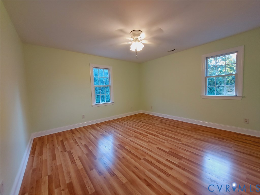18313 Shiloh Church Road Beaverdam, VA 23015 - Photo 27 of 39 a view of empty room with wooden floor and fan