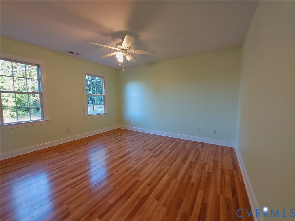 18313 Shiloh Church Road Beaverdam, VA 23015 - Photo 30 of 39 a view of empty room with wooden floor and fan