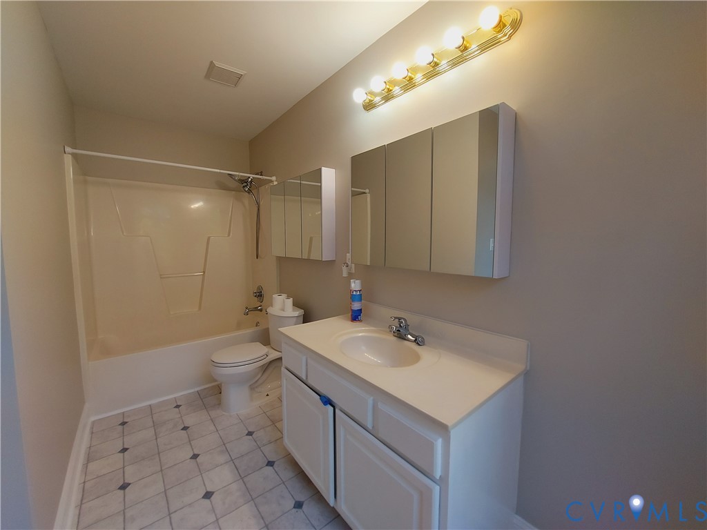 18313 Shiloh Church Road Beaverdam, VA 23015 - Photo 33 of 39 a bathroom with a sink toilet and shower