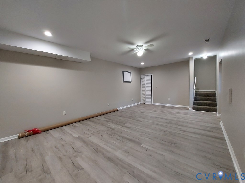 18313 Shiloh Church Road Beaverdam, VA 23015 - Photo 36 of 39 an empty room with wooden floor and windows