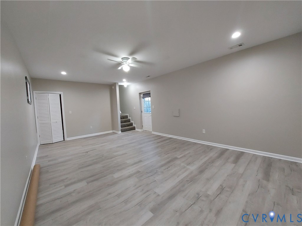 18313 Shiloh Church Road Beaverdam, VA 23015 - Photo 37 of 39 an empty room with wooden floor and a ceiling fan
