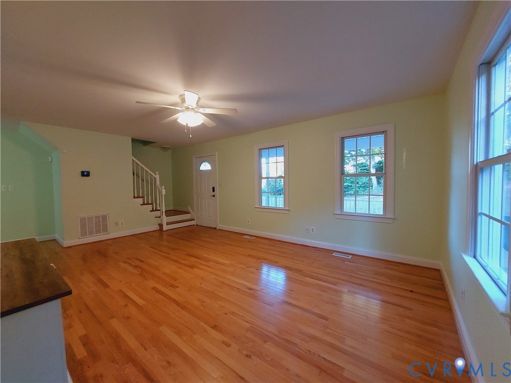 18313 Shiloh Church Road Beaverdam, VA 23015 - Photo 6 of 39 a bedroom with a bed and a chandelier