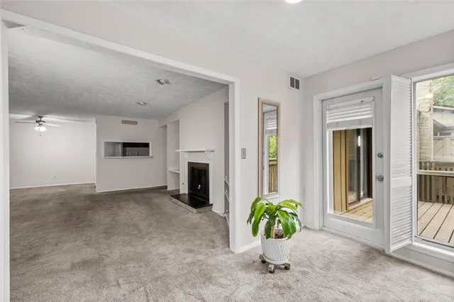 a balcony with wooden floor and fence