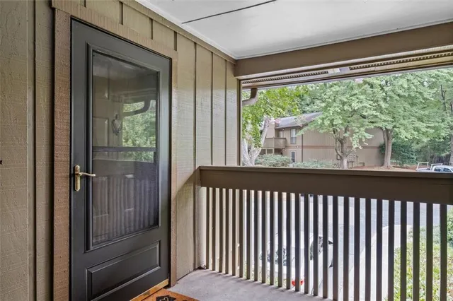 a view of a porch with a floor to ceiling window