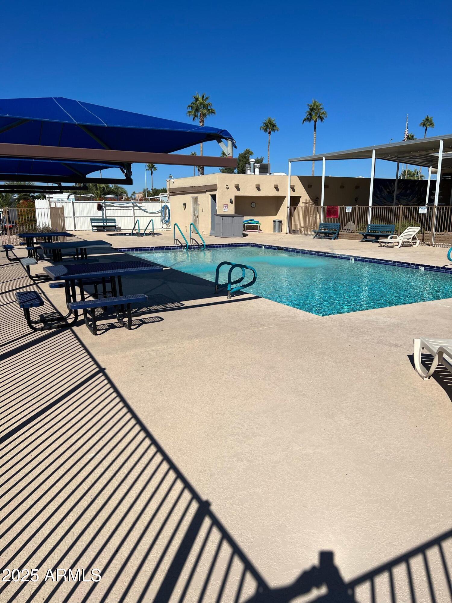 9501 East Broadway Road, Unit 119 Mesa, AZ 85208 - Photo 21 of 24 a view of swimming pool with outdoor seating