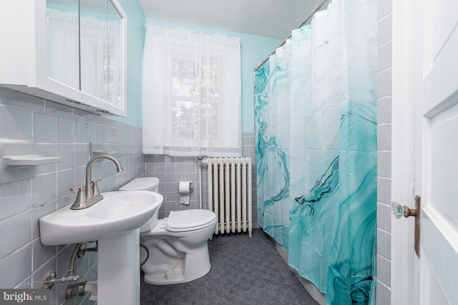 401 West Avenue Delanco, NJ 08075 - Photo 14 of 19 a bathroom with a sink and toilet