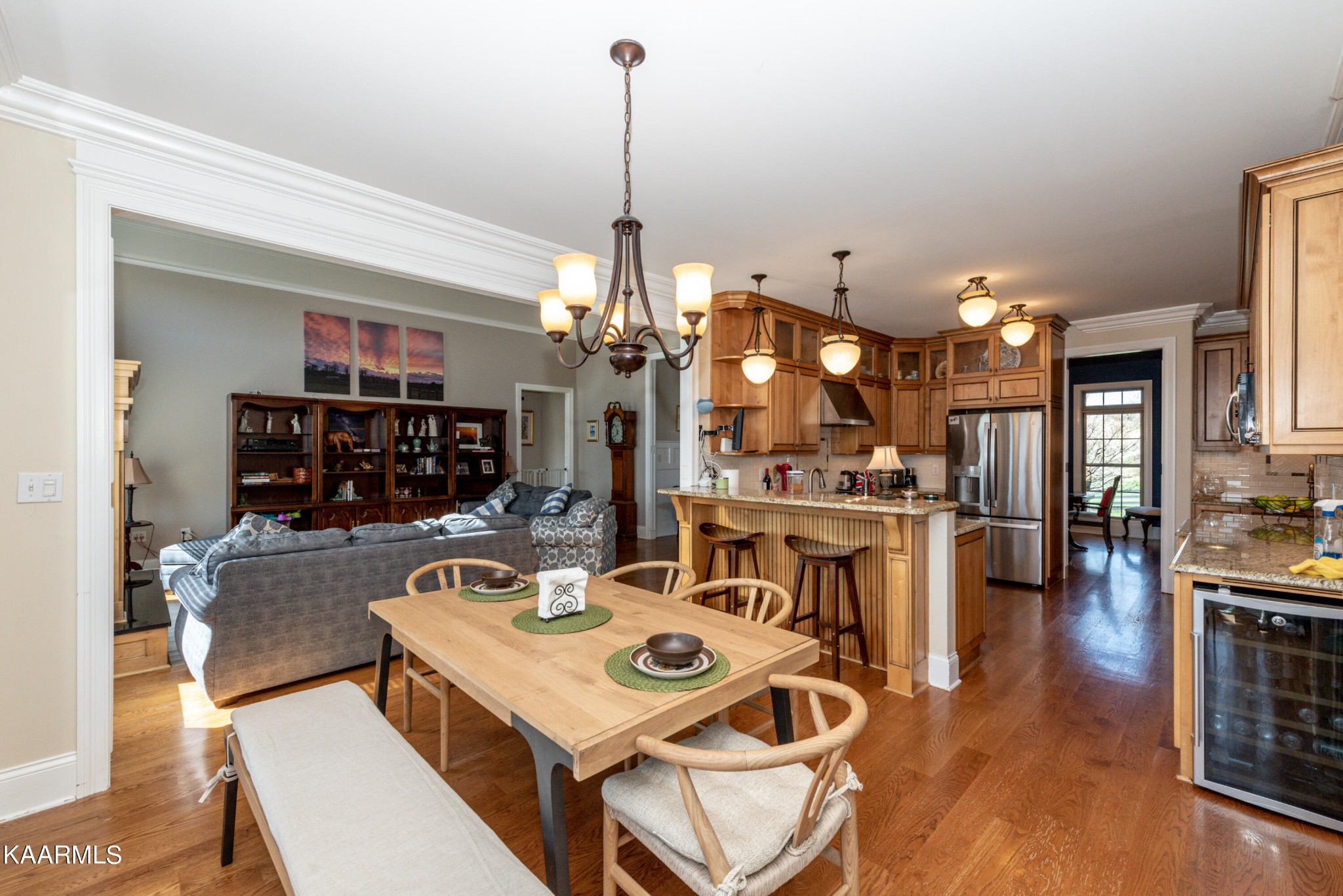 6069 Morganton Road Greenback, TN 37742 - Photo 24 of 60 a view of a dining room and livingroom with furniture wooden floor a chandelier
