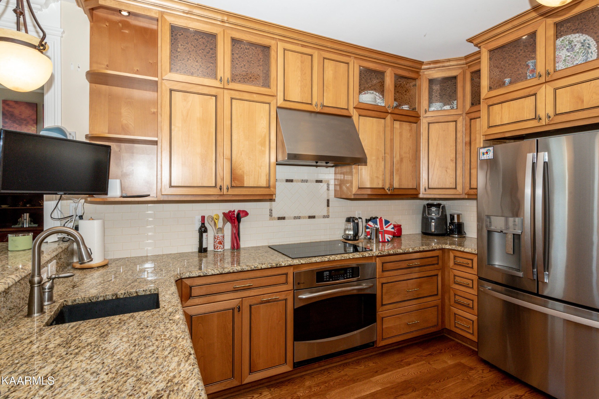 6069 Morganton Road Greenback, TN 37742 - Photo 27 of 60 a kitchen with stainless steel appliances granite countertop a refrigerator stove and sink