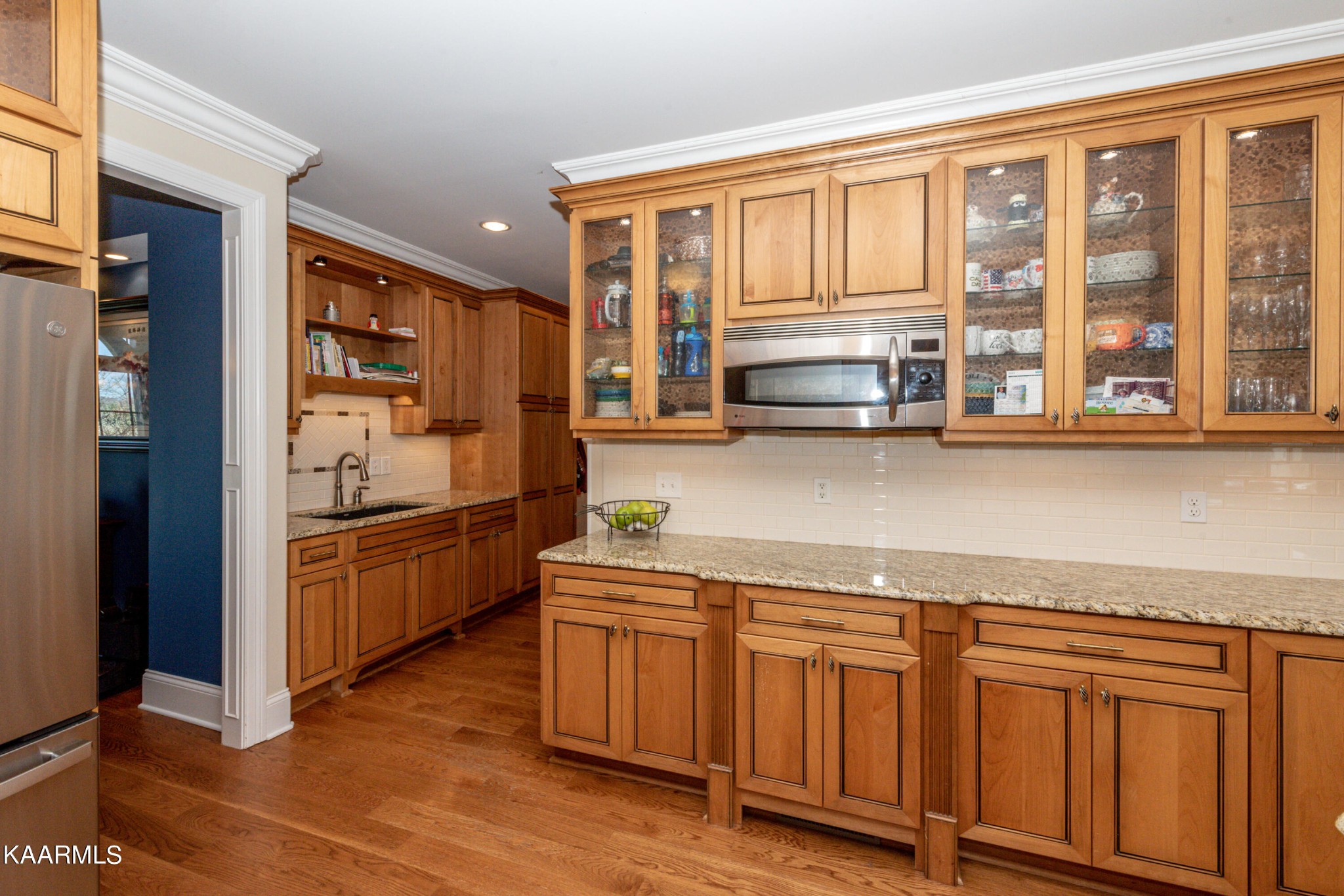6069 Morganton Road Greenback, TN 37742 - Photo 29 of 60 a kitchen with stainless steel appliances granite countertop a refrigerator and wooden cabinets