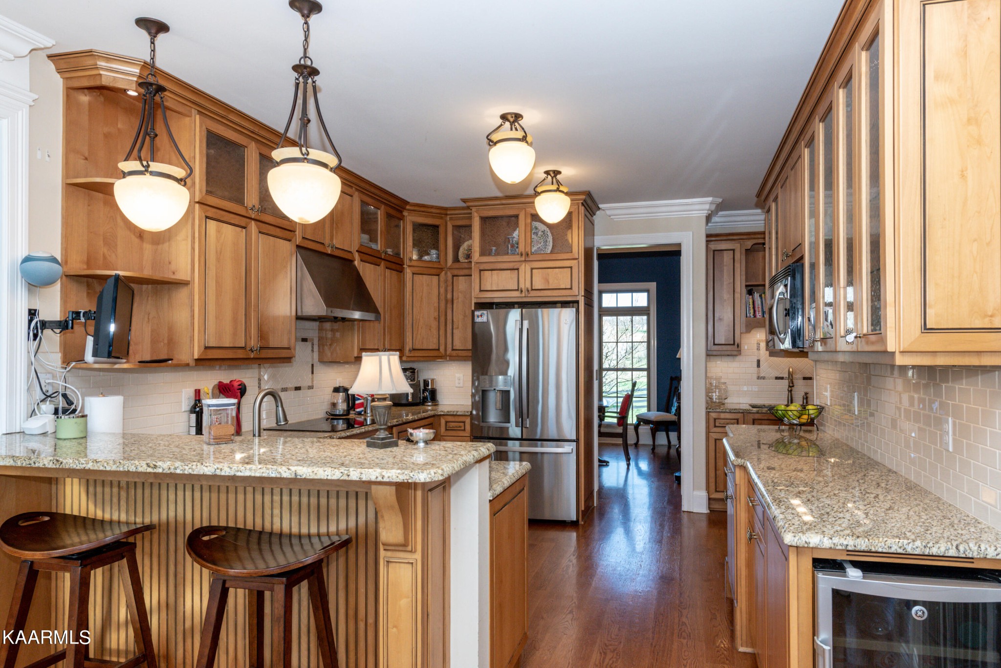 6069 Morganton Road Greenback, TN 37742 - Photo 32 of 60 a kitchen with stainless steel appliances granite countertop a sink a stove cabinets and a dining table