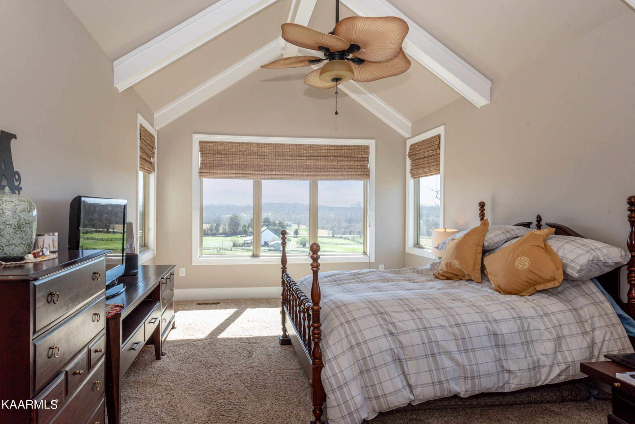 6069 Morganton Road Greenback, TN 37742 - Photo 38 of 60 a bedroom with a bed a flat screen tv and a large window