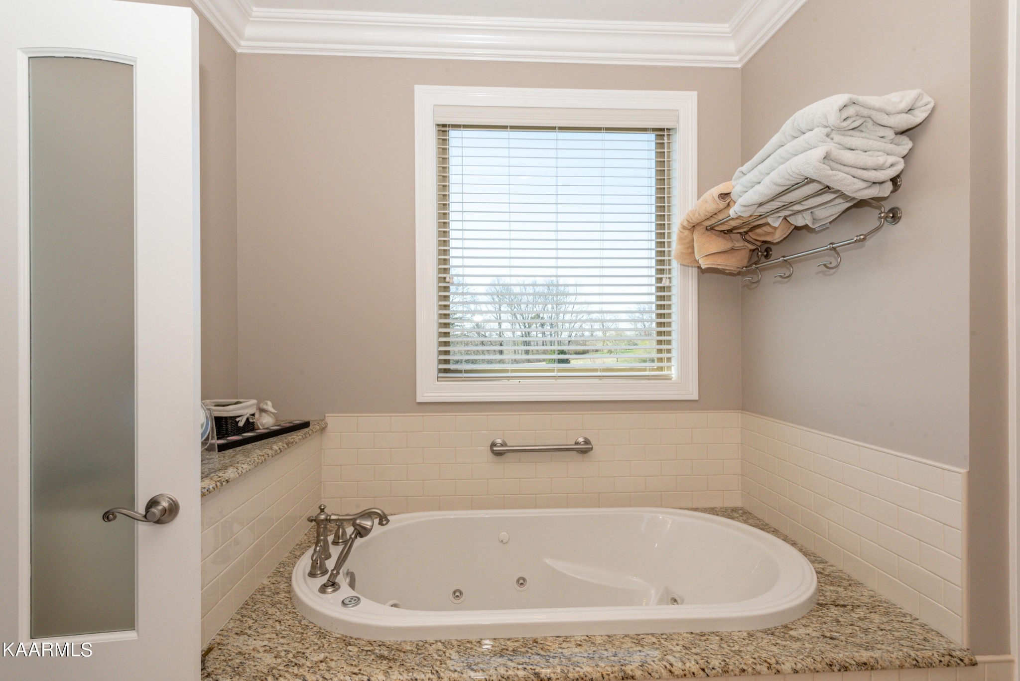 6069 Morganton Road Greenback, TN 37742 - Photo 41 of 60 a white bath tub sitting in a bathroom next to a window