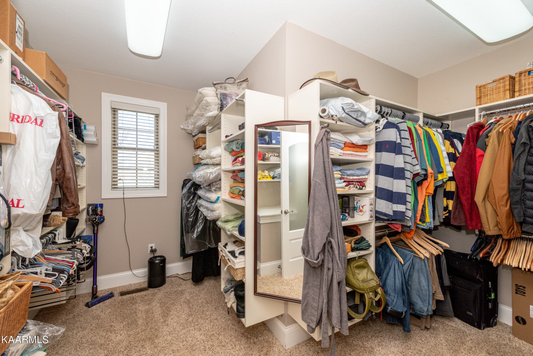 6069 Morganton Road Greenback, TN 37742 - Photo 42 of 60 a view of walk in closet with clothes