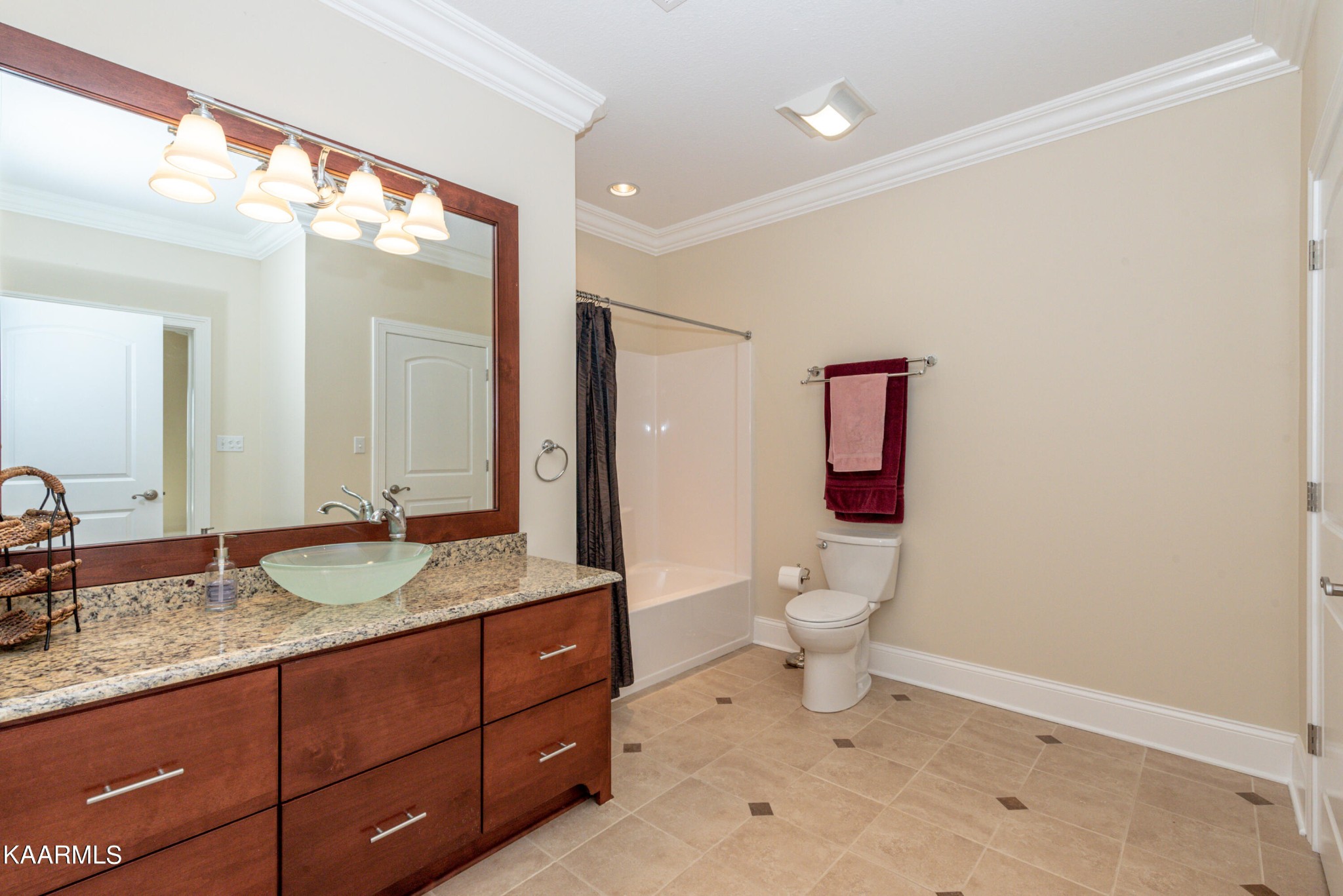 6069 Morganton Road Greenback, TN 37742 - Photo 48 of 60 a bathroom with a granite countertop sink toilet and large mirror
