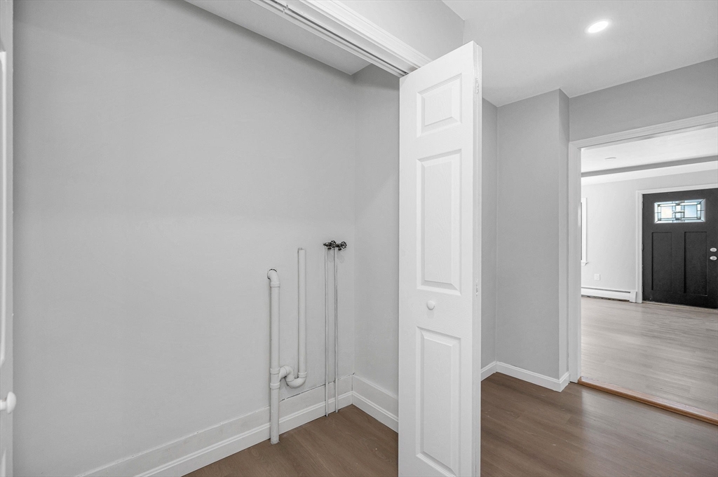 52 Elm Street Haverhill, MA 01830 - Photo 11 of 40 a view of a hallway with wooden floor