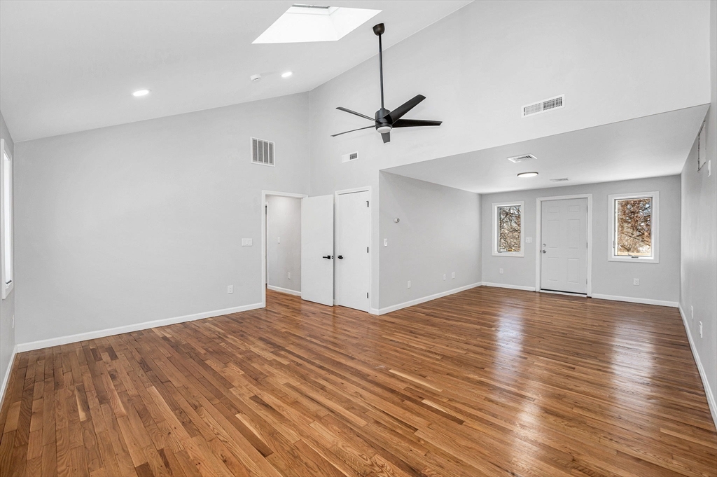52 Elm Street Haverhill, MA 01830 - Photo 14 of 40 a view of empty room with wooden floor and ceiling fan