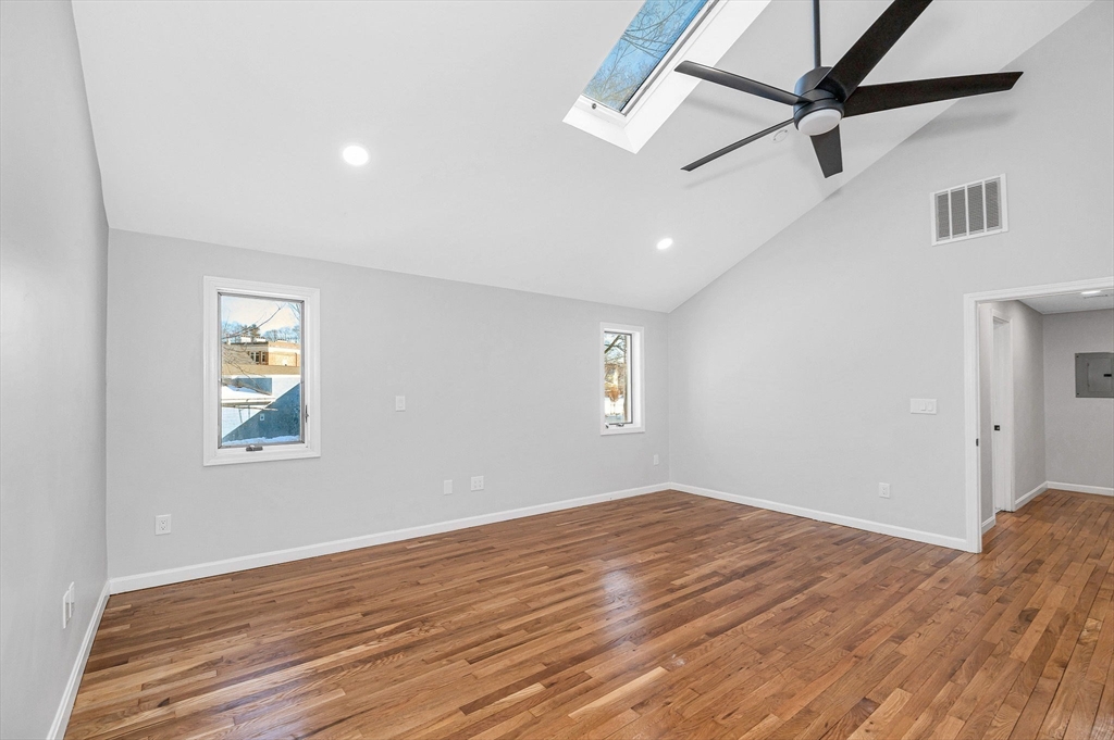 52 Elm Street Haverhill, MA 01830 - Photo 16 of 40 a view of empty room with wooden floor and fan