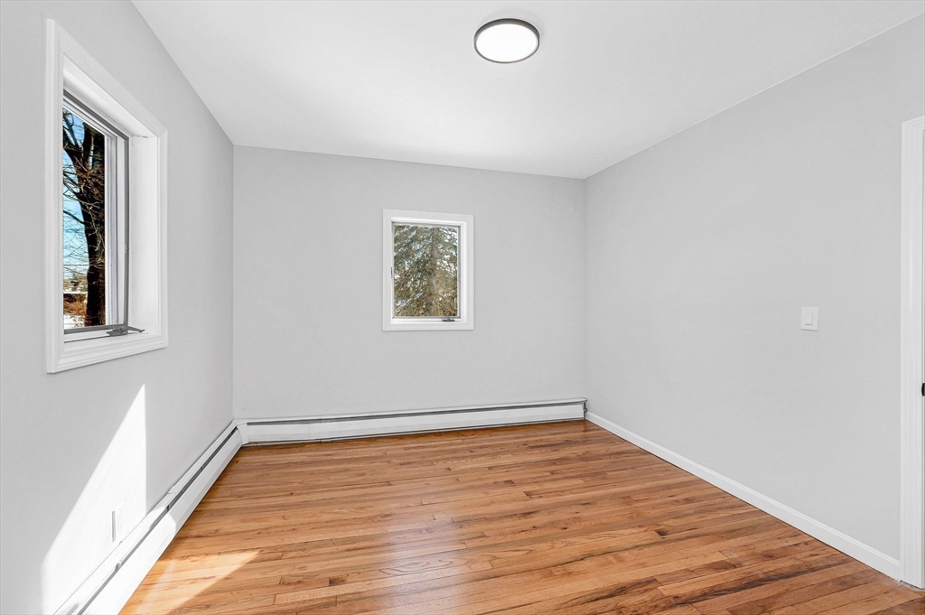 52 Elm Street Haverhill, MA 01830 - Photo 26 of 40 a view of a room with wooden floor and window