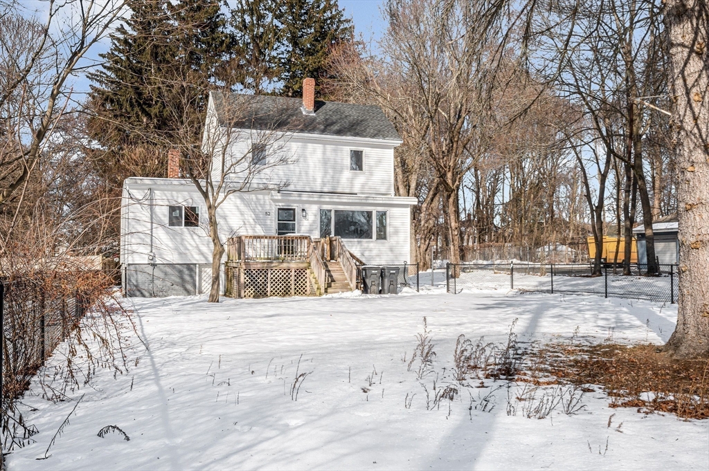 52 Elm Street Haverhill, MA 01830 - Photo 32 of 40 a view of a house with a snow in the yard