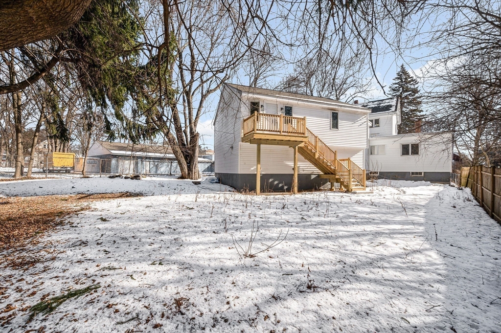 52 Elm Street Haverhill, MA 01830 - Photo 34 of 40 a view of a house with snow on the background