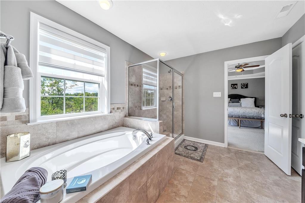 896 Ashley Road Gibsonia, PA 15044 - Photo 13 of 25 a spacious bathroom with a tub and a view of bathroom
