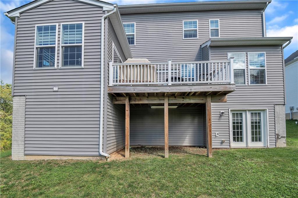 896 Ashley Road Gibsonia, PA 15044 - Photo 24 of 25 a front view of a house with a garden