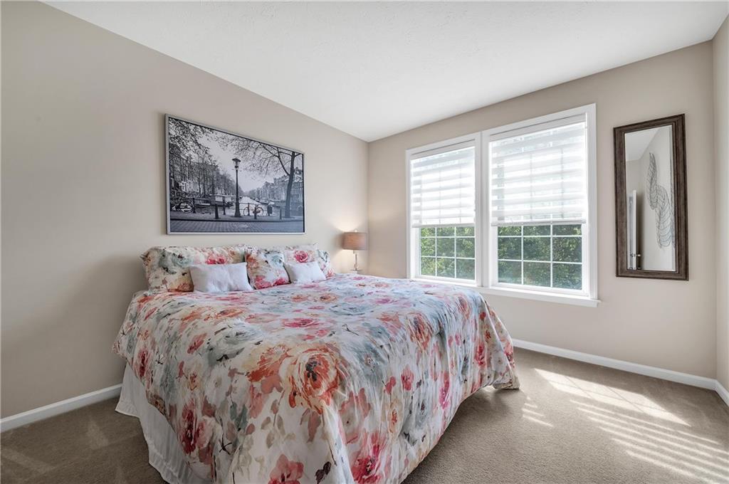896 Ashley Road Gibsonia, PA 15044 - Photo 9 of 25 a large bed sitting in a bedroom next to a window