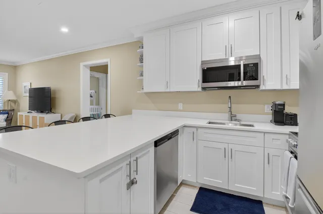 a kitchen with a sink and cabinets