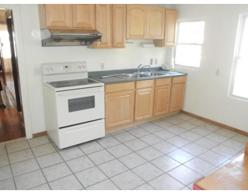 53 Harvard Street Extension Natick, MA 01760 - Photo 4 of 11 a kitchen with a sink cabinets and window