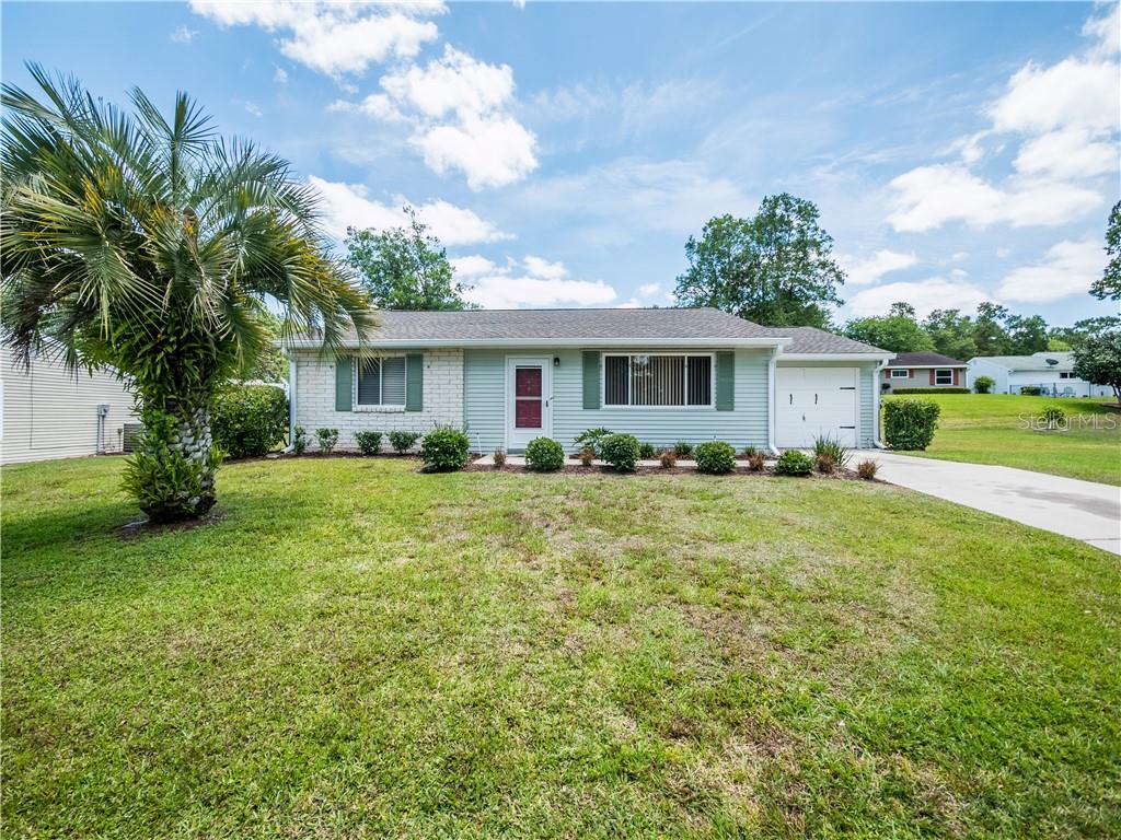 8954 Southwest 109th Lane Ocala, FL 34481 - Photo 1 of 1 FRONT ELEVATION WITH BRICK ACCENT.
