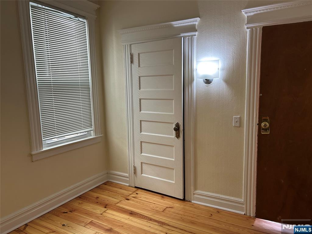 192 Kearny Avenue, Unit 2 Kearny, NJ 07032 - Photo 10 of 16 a view of an empty room with wooden floor and closet