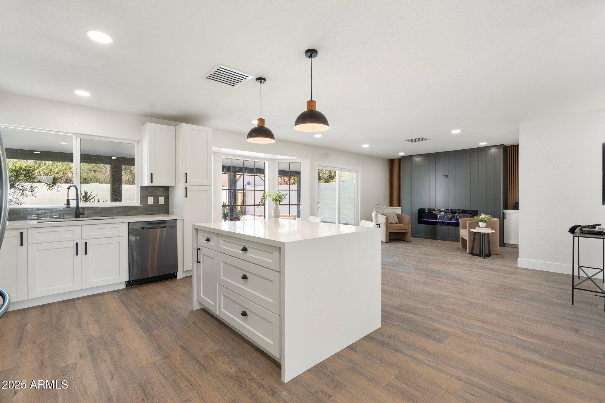 1721 North Apache Drive Chandler, AZ 85224 - Photo 7 of 22 a kitchen with counter top space and wooden floor