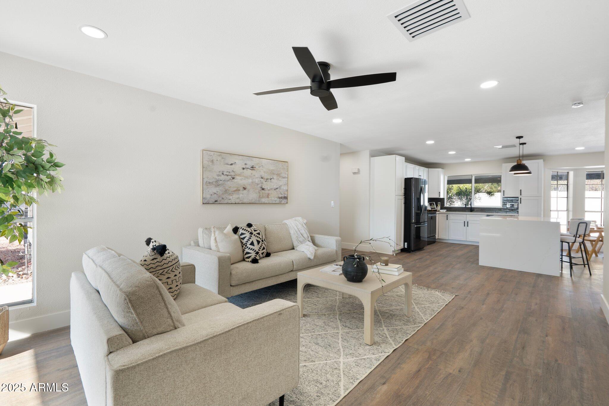 1721 North Apache Drive Chandler, AZ 85224 - Photo 10 of 22 a living room with furniture and kitchen view