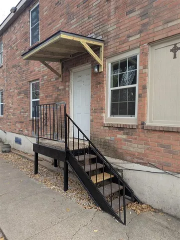 a view of backyard with deck and outdoor seating
